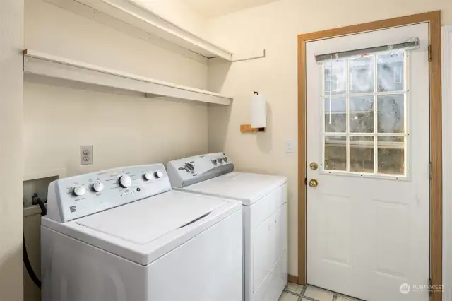 Utility room shares a room with the 3/4 bath. Door goes to backyard.