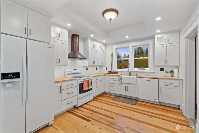 Spacious kitchen with a pasture view.