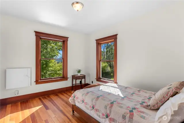 Cozy third bedroom with a front lawn view.