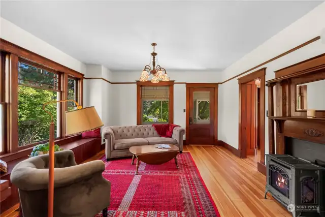 Beautifully redone fir flooring and original trim throughout the large living room and home.