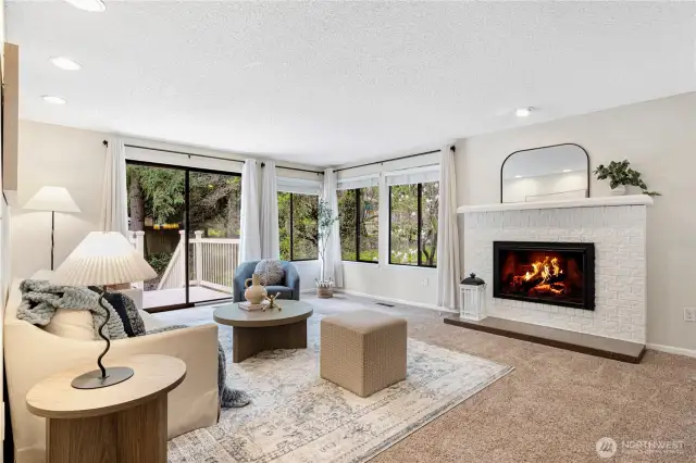 Living room with fireplace and access to deck.