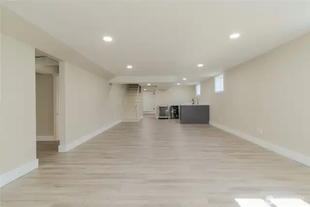 High ceilings in the fully remodeled basement with area for 2nd Kitchen. Large open space for extra Living, Theater, Game room, or even to rent out on Air BNB as owner can live upstairs and rent basement out.