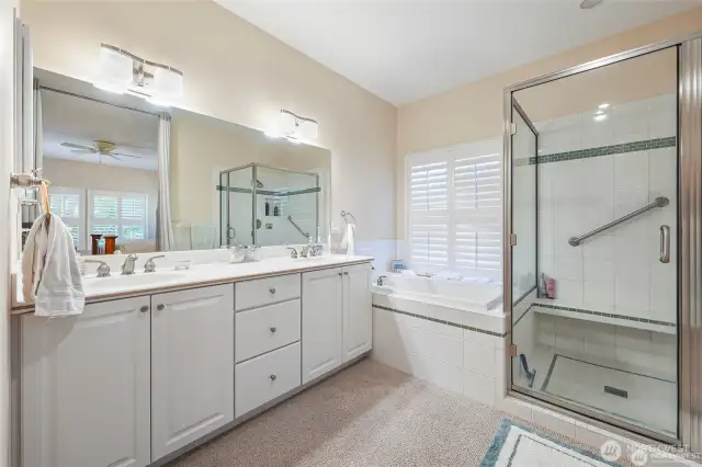 Primary bathroom with 2 sinks, shower and soaking tub