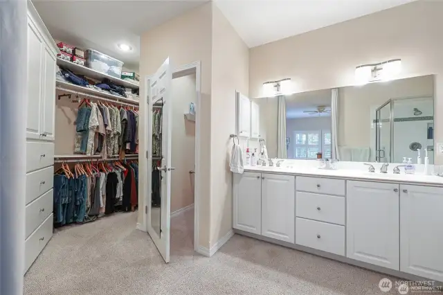 Large walk in closet with built-ins just off the primary bathroom