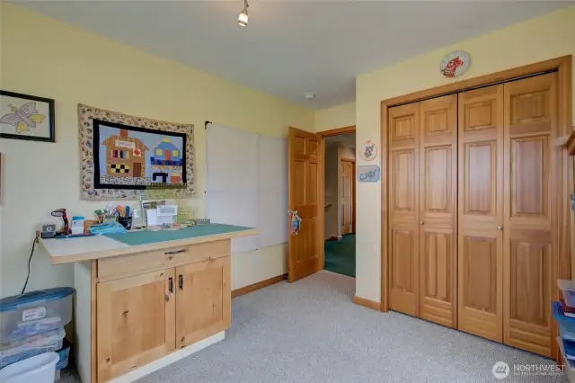 This bedroom is currently in use as a sewing/craft room, but you can see it is a generously sized room.