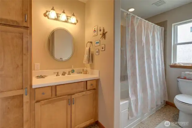 The second floor bathroom is a full bath with ample storage space.