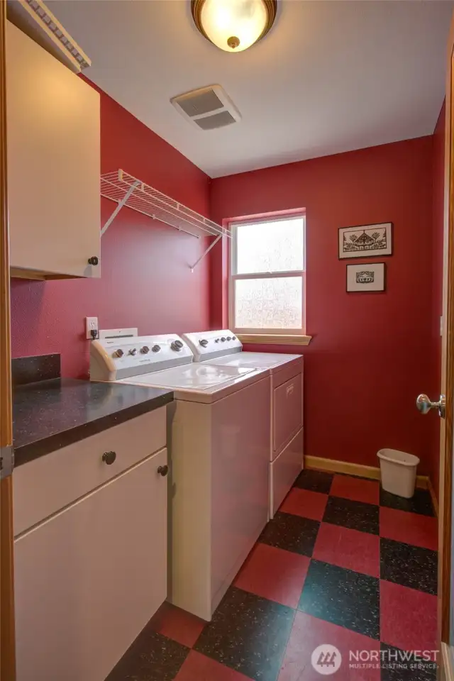 And the laundry room is large and functional with work space.