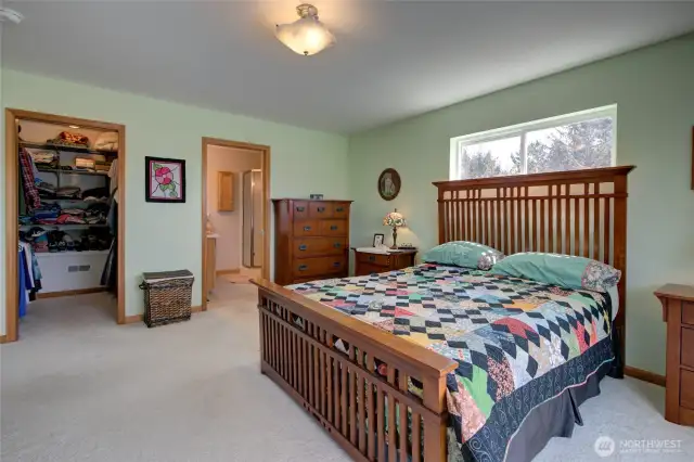 The opposite side of the primary has a spacious walk in closet and en-suite bath.