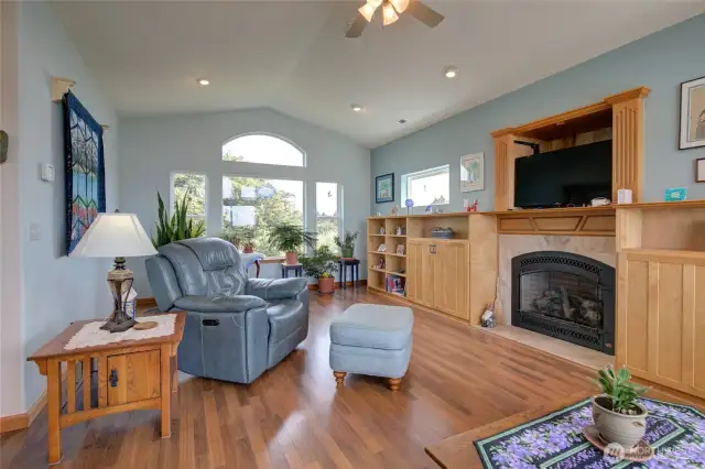 Looking towards the East side of the living room, the large windows bring in the morning light.