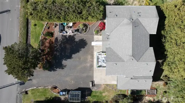 From above, you can see the thoughtful utilization of all the space on this lot.  From home placement, to landscaping, firepit area, greenhouse and garden space, parking....nothing was overlooked in the design of the entire home and property!