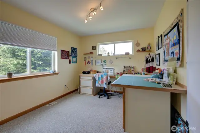 Heading up to the second floor, you will find three bedrooms, including the primary suite, two bathrooms, and the laundry/utility room.