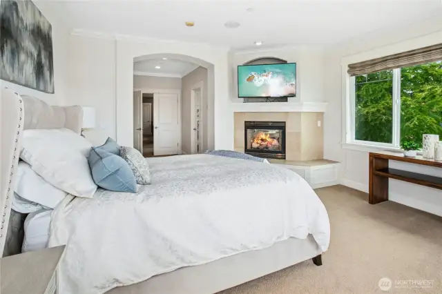 The primary suite has a gas fireplace for cozy evenings.