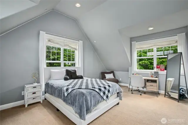 This generous bedroom with ensuite bath is on the upper level. Charming architecture, a large walk-in closet and secret storage/cozy reading nook makes this a very special place for someone very special.