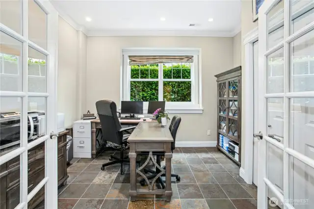 The lower level features a fourth bedroom which is currently being used as a second office. There is a full-sized closet along with recessed lighting, crown molding and French doors.