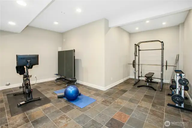 Also on the lower level is this large bonus room, currently being used as a home gym. This would also be the perfect place for additional storage items.