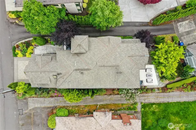 This photo was taken directly over the home. The north side of the home has that sidewalk leading from the garage area all the way down to the lake. Across the street from your home is additional parking and the Eastside Rail Corridor Trail, which is the perfect place to take a stroll or ride your bike. What a great way to get exercise and meet the friendly neighbors!