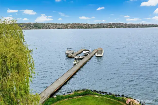 The dock is shared with the neighbor and has a boat lift and room for a jet ski. Your boat would be on the south side of the dock (boat on the far left in this photo) and your jet ski would be docked nearest the shore. Jet ski and jet ski lift are not included in this sale, but the boat lift is.
