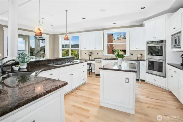 Every floor has great views of Lake Washington and the Olympic Mountains. Can you imagine cooking and entertaining here?