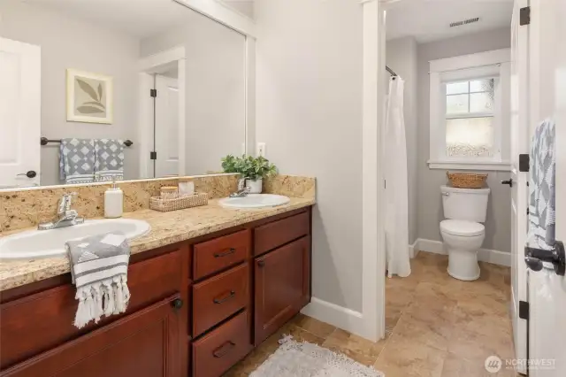 Dual vanity, full bathroom on upper level. 2 additional bedrooms share this bathroom.