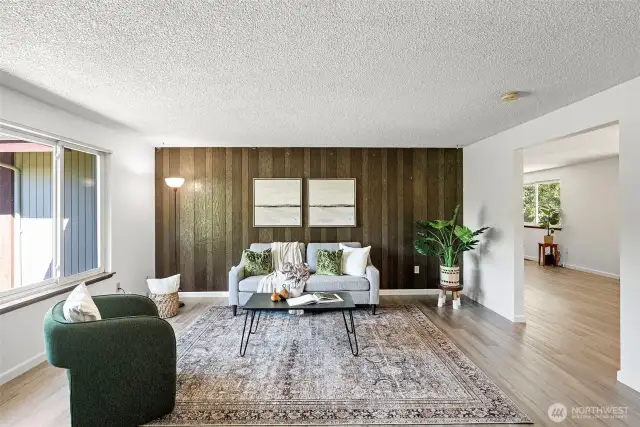 Living room with views of the lush front yard!