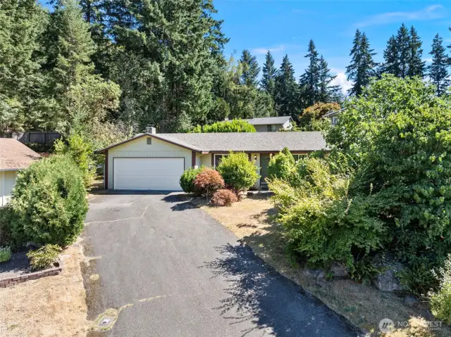 Spacious 2-car garage and long driveway with ample room for all your vehicles!