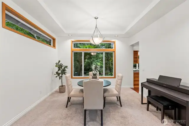 Formal Dining Room with big bright windows and high ceilings.