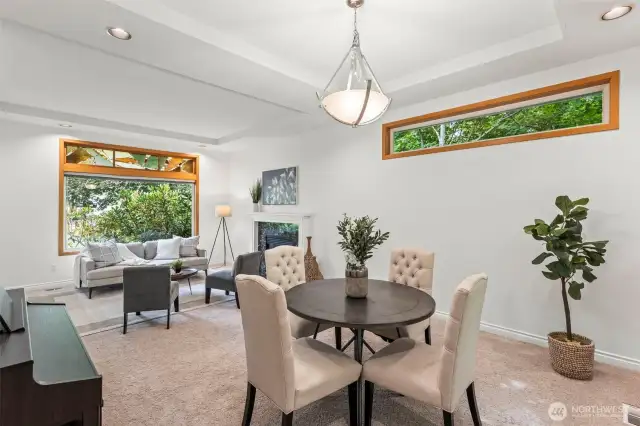Formal Living & Dining Room with big bright windows and high ceilings.