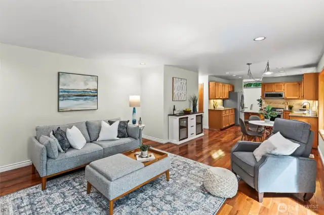 Open concept living room to kitchen, dining and the outdoor deck.
