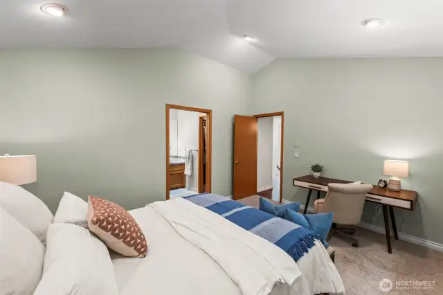 Elegant Primary bedroom with amazing vaulted ceilings!