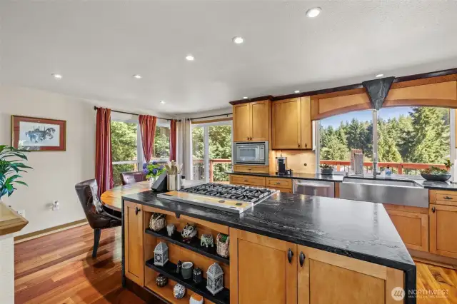 Chef's kitchen with exquisite wood cabinets! Don't miss the undercabinet lights. Deep stainless steel sink and appliances.