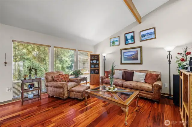The Brazilian Koa floors are a beautiful and striking feature of the living room.
