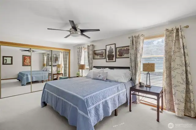 Mirrored closets and ceiling fan.