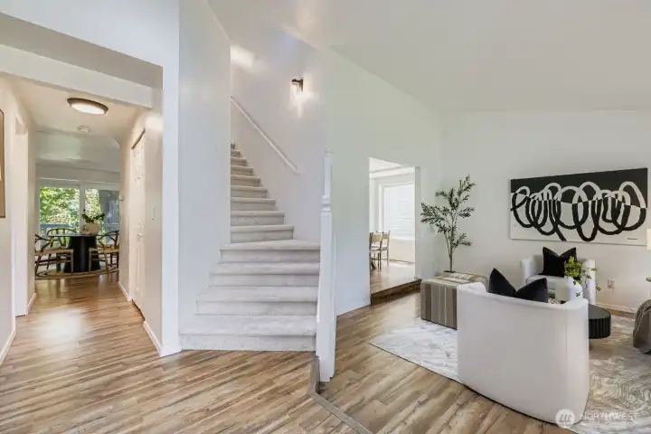 Vaulted ceiling living room with skylights.
