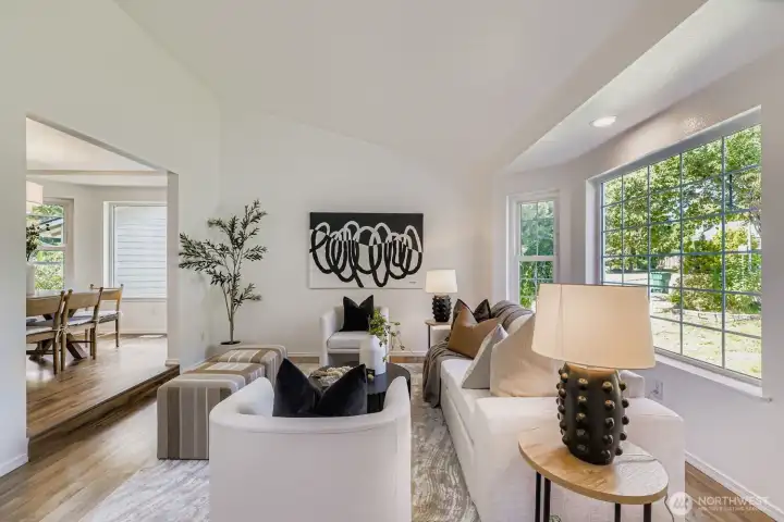 Vaulted ceiling living room with skylights.