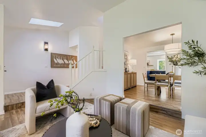 Vaulted ceiling living room with skylights.