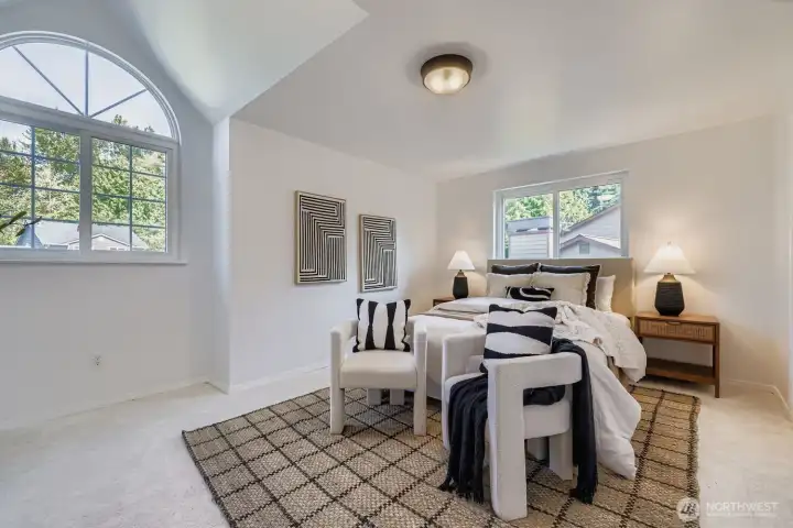 Light filled primary bedroom.