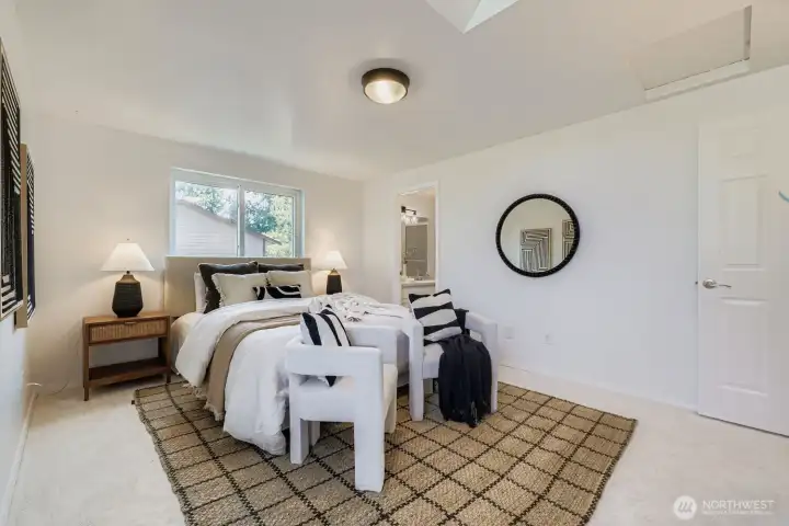 Light filled primary bedroom and en-suite bath.