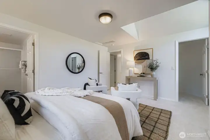 Light filled primary bedroom and en-suite bath..