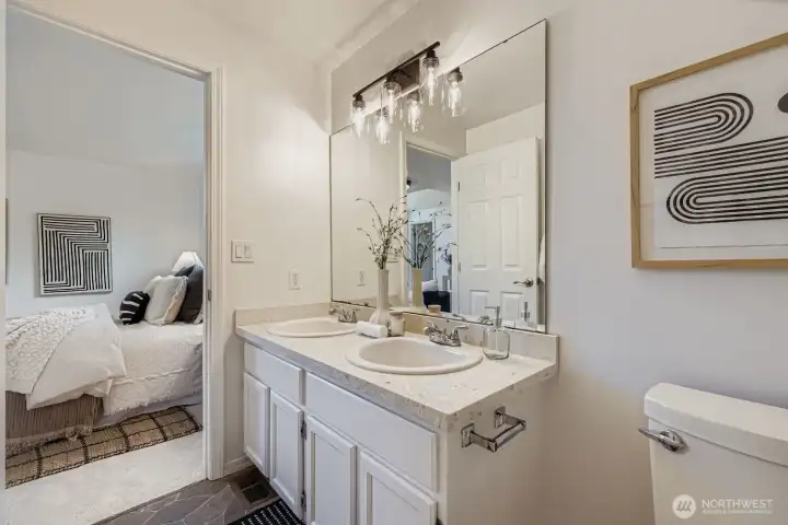 Primary ensuite bath with quartz counters.