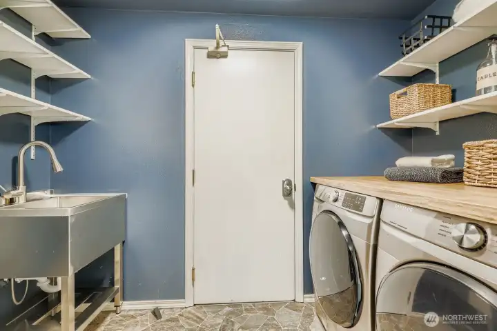 Laundry room with storage plus washer & dryer that convey with the home.