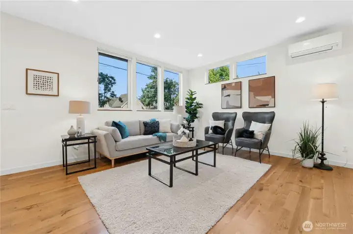 Living room can accommodate a small or large group. Premium window shades move up and down from top or bottom, creating the perfect amount of privacy while letting maximum light in.