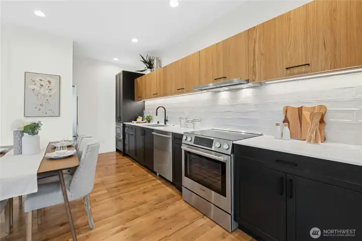 Bosch kitchen appliances continue to impress you with a quality level that's unusual in homes like this one. This builder left no stone unturned! Can you spot the range hood? You must come try it for yourself - it tucks away when not in use! Did you notice where the microwave sits? Another cool design touch!