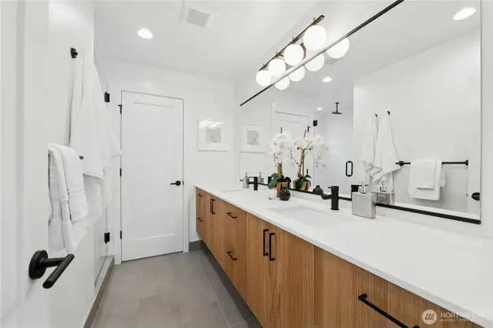 Wow! Check out the length of that ensuite primary bathroom countertop! So much storage and space, making sharing a bathroom so much easier.