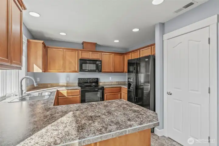 Tons of cabinetry and a walk-in pantry.