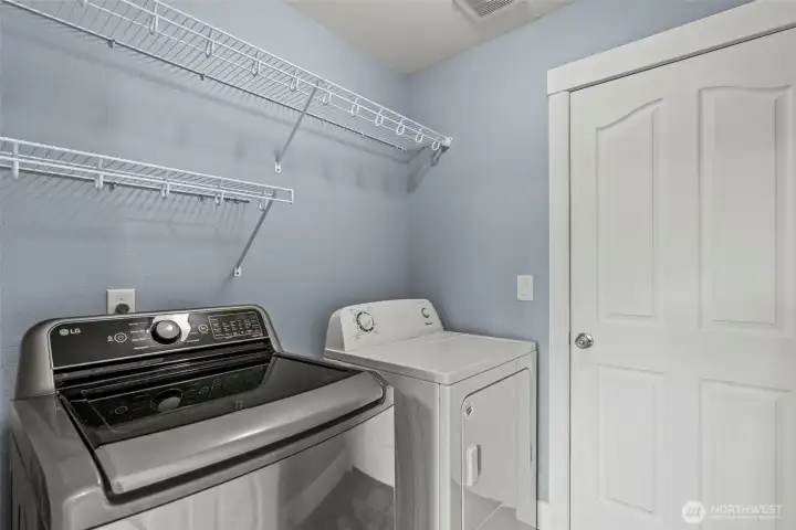 Laundry Room leading to 2-car Garage