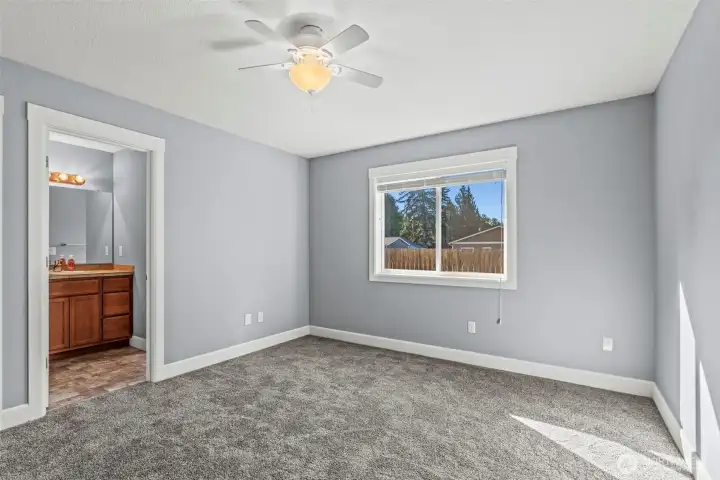 Primary Bedroom with Bathroom and Walk-In Closet
