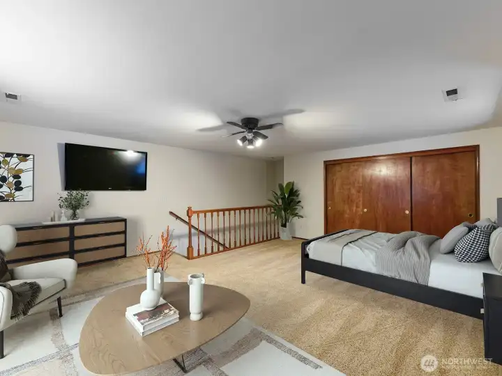 Staged upstairs bedroom Large and closet w/ shelves.