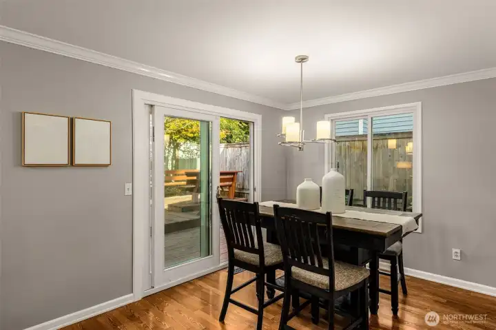 Patio leads to fully fenced yard