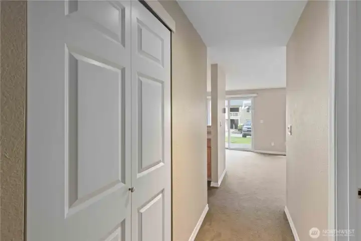 Hallway with great storage closets.