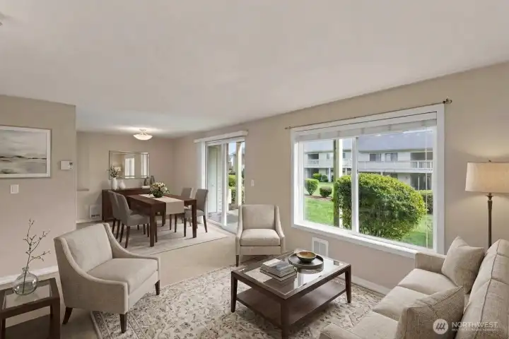 Open concept living and dining room. Easy ground floor entrance from patio.  *Room is digitally staged to give you design inspiration!